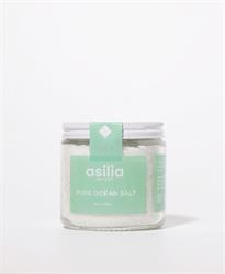Pure Ocean Salt in a clear jar with a green label from Asilia Salt.