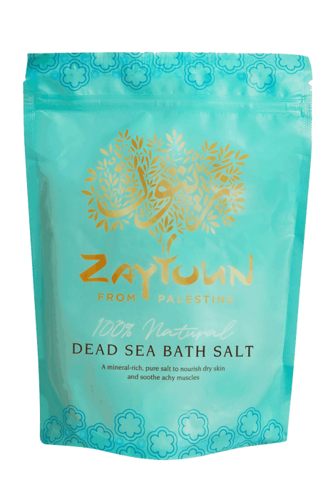 Zaytoun  Natural Dead Sea Salt 750g in a turquoise bag, designed to nourish dry skin and soothe aches.