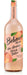 Non-alcoholic peach Bellini beverage in transparent glass bottle with peach and leaf illustrations, by Belvoir.